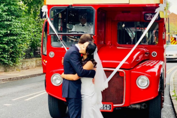 Routemaster bus with happy couple